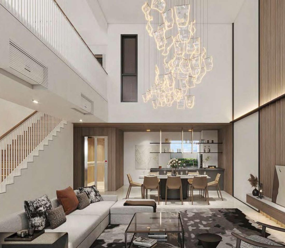 The living and dining room, double-volume ceiling with the private lift alongside the staircase.